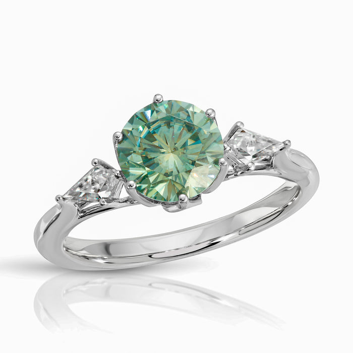 green round moissanite ring with kite cut moissanite side stone